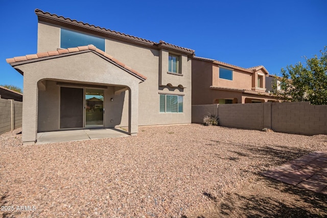 rear view of property with a patio area