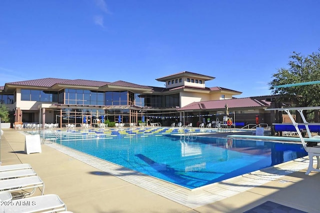 view of swimming pool featuring a patio area