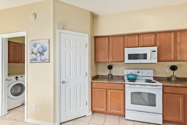 kitchen featuring washer / clothes dryer, white appliances, and light tile patterned flooring