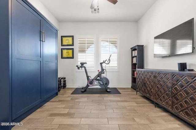 11249 N Blakely St, Surprise, AZ 85388 - exercise room featuring light wood-style flooring, ceiling fan, and baseboards