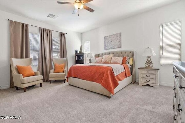 11249 N Blakely St, Surprise, AZ 85388 - bedroom with light carpet, a ceiling fan, and baseboards