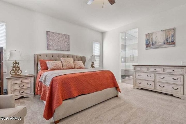 11249 N Blakely St, Surprise, AZ 85388 - bedroom with light carpet, ensuite bathroom, and ceiling fan