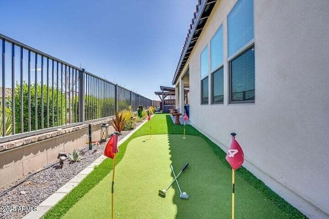 11249 N Blakely St, Surprise, AZ 85388 - view of property's community with a putting area and a fenced backyard