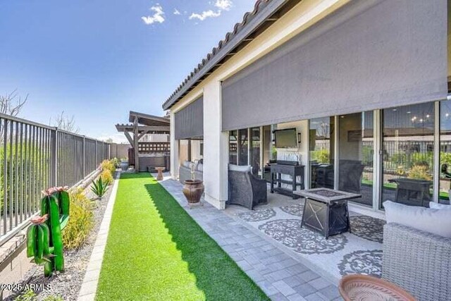 11249 N Blakely St, Surprise, AZ 85388 - fenced backyard featuring a fire pit and a patio area