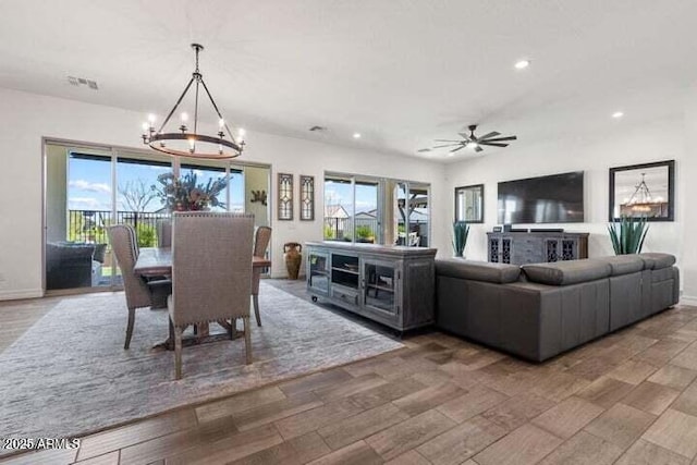 11249 N Blakely St, Surprise, AZ 85388 - dining room featuring a chandelier, recessed lighting, plenty of natural light, a ceiling fan, and baseboards