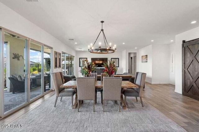 11249 N Blakely St, Surprise, AZ 85388 - dining area featuring a chandelier, light wood finished floors, and recessed lighting