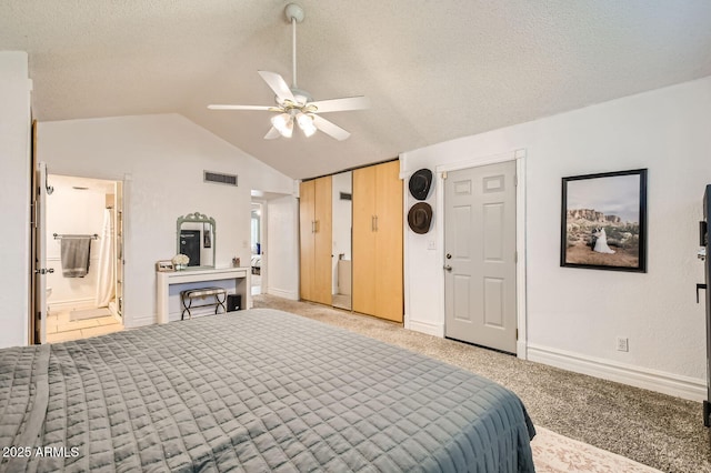 624 N Ashbrook Cir, Mesa, AZ 85213 - bedroom with light carpet, a textured ceiling, lofted ceiling, baseboards, and connected bathroom