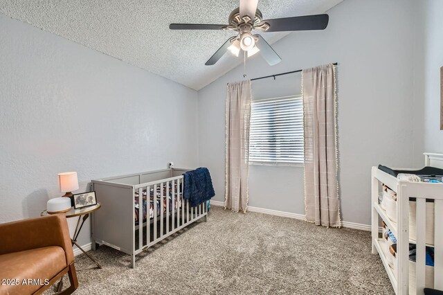 624 N Ashbrook Cir, Mesa, AZ 85213 - carpeted bedroom featuring vaulted ceiling, a nursery area, a textured ceiling, baseboards, and a ceiling fan