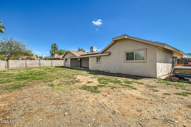 624 N Ashbrook Cir, Mesa, AZ 85213 - back of property with stucco siding, a fenced backyard, and central air condition unit