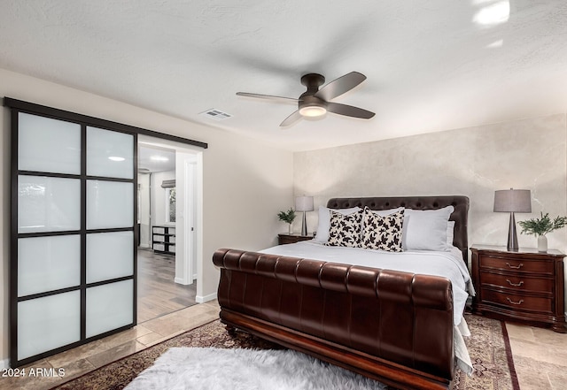 bedroom featuring ceiling fan and light hardwood / wood-style flooring