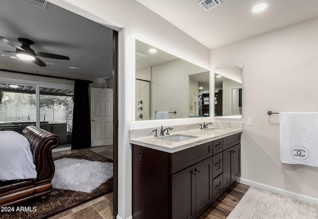 bathroom featuring hardwood / wood-style floors, vanity, and ceiling fan