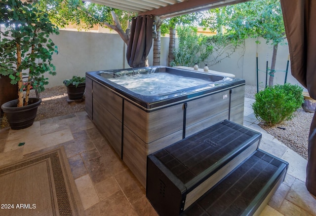 view of patio featuring a hot tub