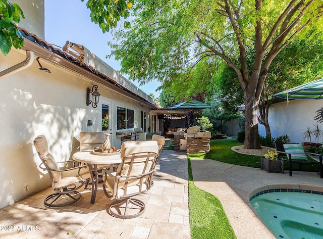 view of patio featuring exterior kitchen