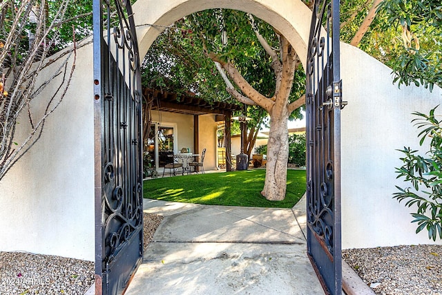 exterior space featuring a yard and a patio