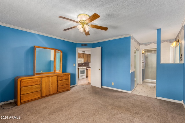 carpeted bedroom featuring ceiling fan, crown molding, a textured ceiling, and connected bathroom