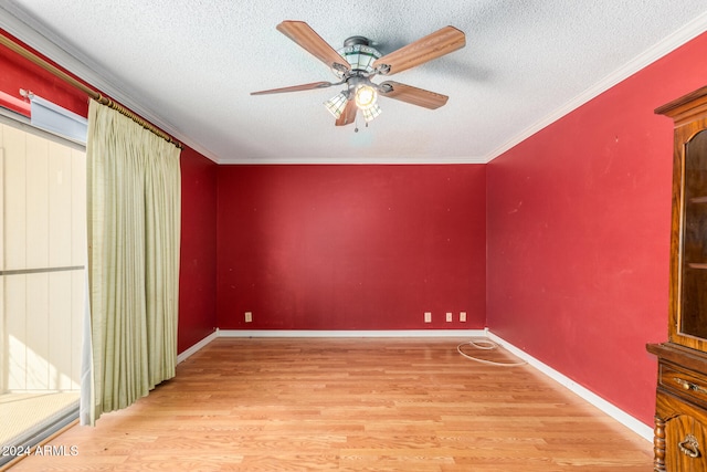 additional living space with ceiling fan, light hardwood / wood-style floors, and a textured ceiling