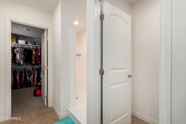 corridor featuring baseboards