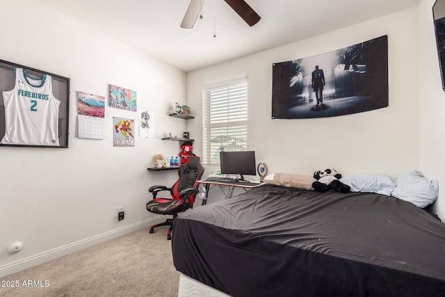 carpeted bedroom with baseboards and a ceiling fan