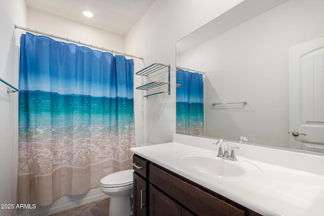 bathroom featuring vanity, toilet, and curtained shower