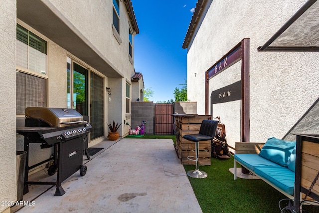 view of patio / terrace with a gate and fence