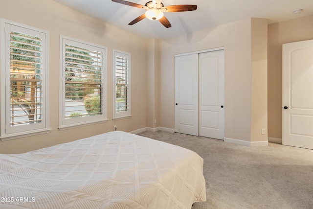 31207 N 124th Dr, Peoria, AZ 85383 - bedroom with light carpet, a closet, baseboards, and a ceiling fan
