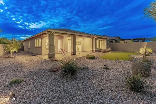 31207 N 124th Dr, Peoria, AZ 85383 - view of side of home with stucco siding, a fenced backyard, and a patio area