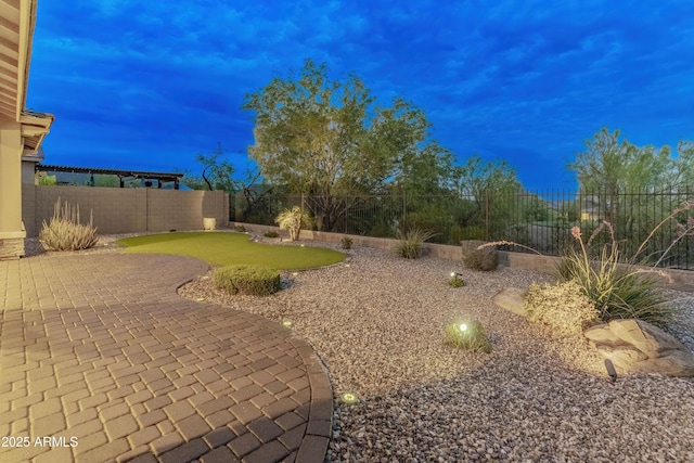 31207 N 124th Dr, Peoria, AZ 85383 - fenced backyard with an area to practice putting and a patio area