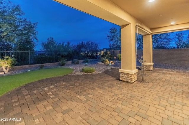31207 N 124th Dr, Peoria, AZ 85383 - patio at night featuring a fenced backyard