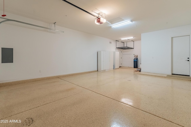 31207 N 124th Dr, Peoria, AZ 85383 - garage with electric panel and a garage door opener