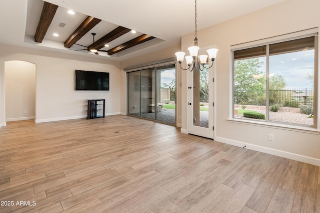 31207 N 124th Dr, Peoria, AZ 85383 - unfurnished room with beamed ceiling, arched walkways, light wood-style floors, a chandelier, and baseboards