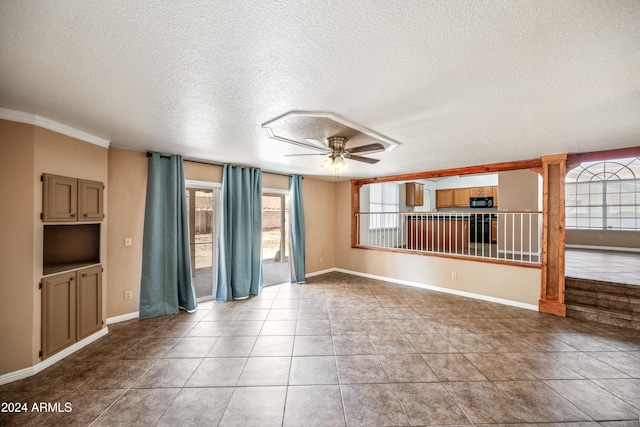 unfurnished living room with ceiling fan, a textured ceiling, crown molding, and light tile patterned floors