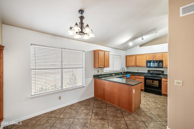 kitchen with pendant lighting, a wealth of natural light, lofted ceiling, and black appliances