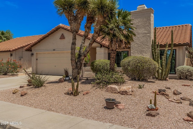 1549 N La Rosa Dr, Tempe, AZ 85288 - mediterranean / spanish-style home featuring a tile roof, stucco siding, and concrete driveway