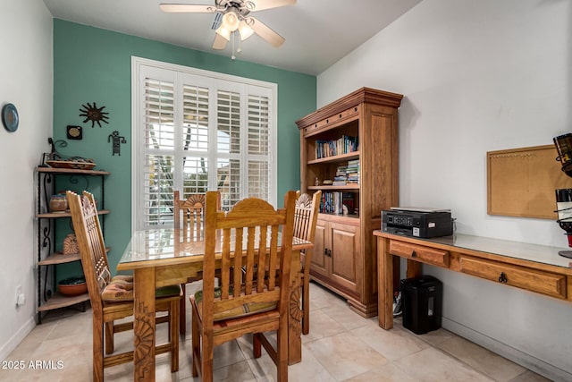 dining space featuring light tile patterned floors and a ceiling fan