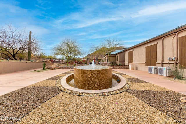 view of yard featuring ac unit, a patio area, and fence