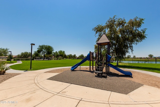 community play area featuring a lawn and a water view