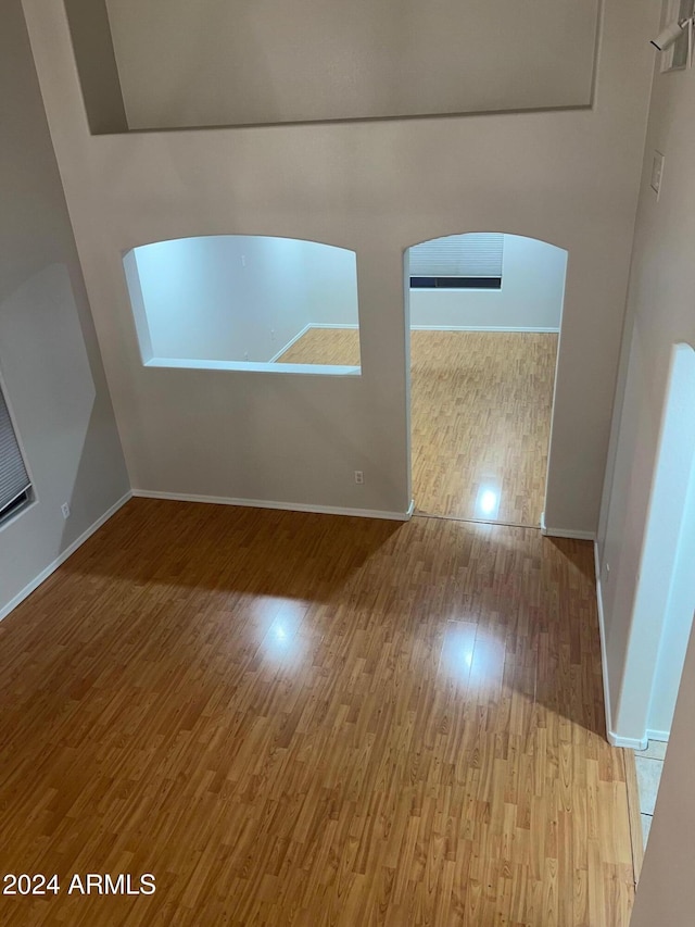 unfurnished room with light hardwood / wood-style floors