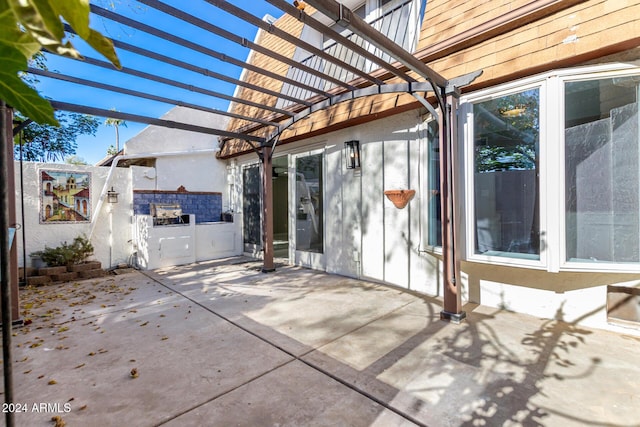 view of patio featuring a pergola and area for grilling