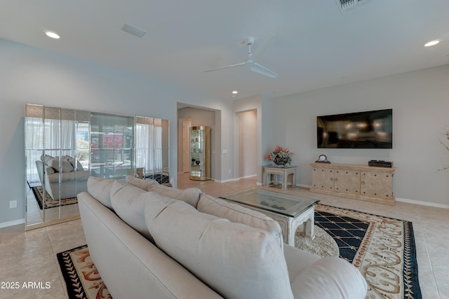 living room with light tile patterned floors, baseboards, and recessed lighting