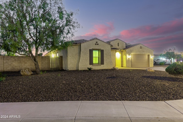 view of front of property with a garage