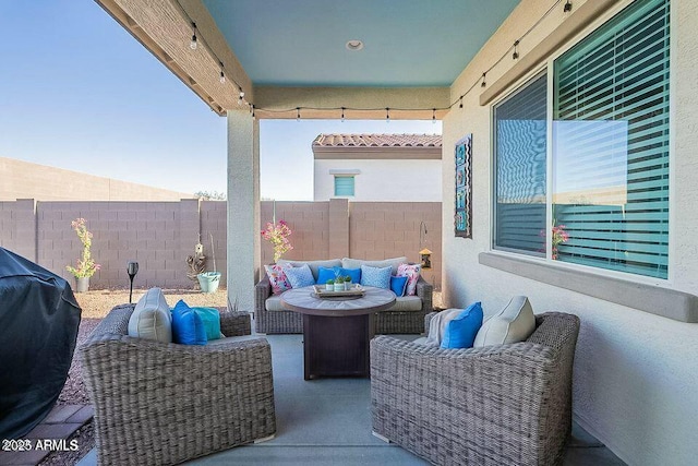 view of patio / terrace with a grill and an outdoor living space with a fire pit