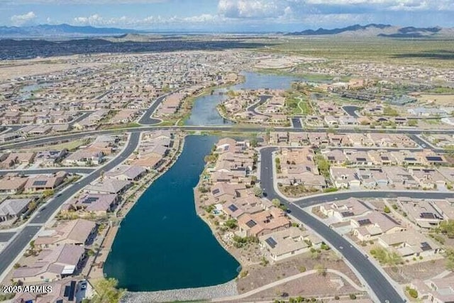 aerial view featuring a water and mountain view