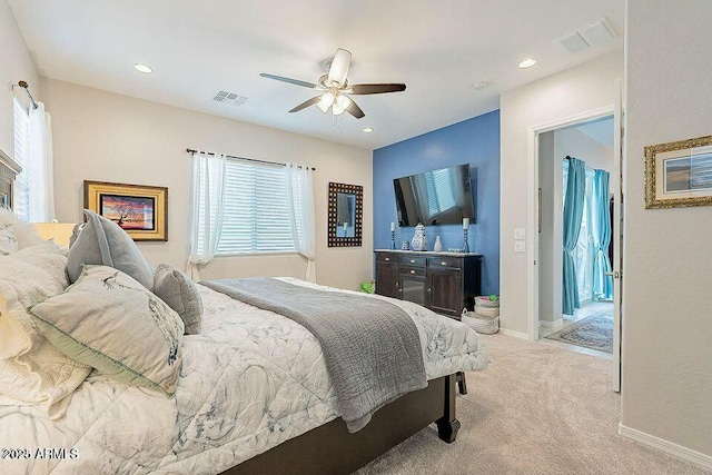 bedroom with light carpet and ceiling fan