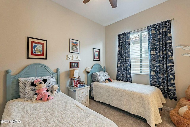 carpeted bedroom featuring lofted ceiling and ceiling fan