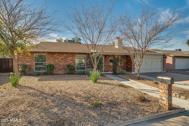 ranch-style home featuring a garage