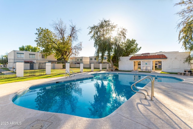 view of swimming pool with fence, a patio area, and a fenced in pool