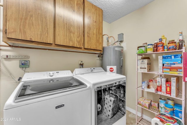 washroom featuring cabinets, a textured ceiling, electric water heater, and separate washer and dryer