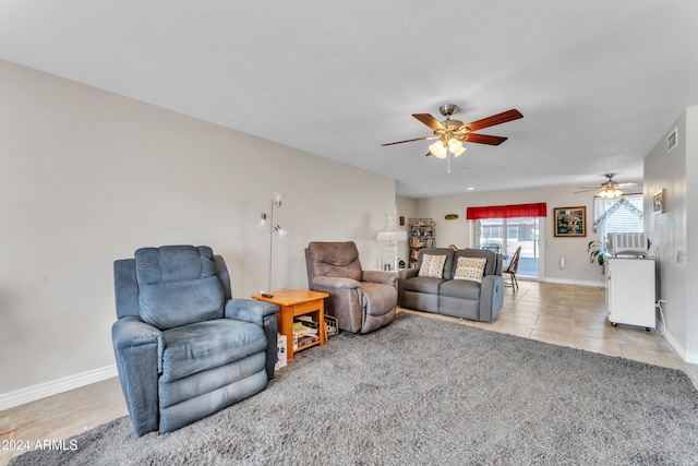 living room featuring ceiling fan and light tile patterned floors