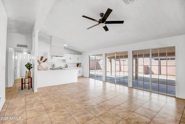 unfurnished living room featuring light tile patterned flooring, ceiling fan, and lofted ceiling