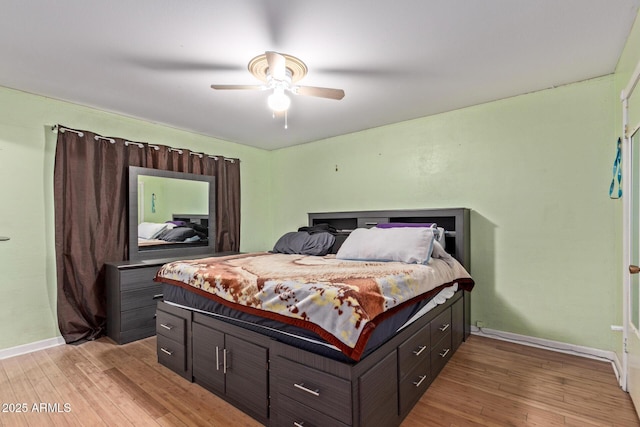 bedroom with hardwood / wood-style flooring and ceiling fan